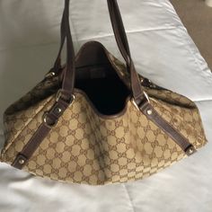 Beautiful Comfortable Authentic Used Gucci Hobo Bag. Used With Love. Gold Tone Hardware. See Pics For Wear Marks. Purchased At Neiman Marcus Boston. Luxury Pre-owned Brown Bag, Pre-owned Brown Monogram Canvas Bag, Pre-owned Designer Brown Bags, Gucci Tote Shoulder Bag With Gold-tone Hardware, Designer Pre-owned Shoulder Bag, Gucci Beige Double Handle Bag, Gucci Brown Satchel For Daily Use, Brown Gucci Bag For Everyday Use, Gucci Brown Tote Satchel