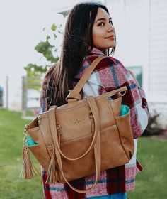 It's our most loved Gemini - but smaller! If you love the Gemini but it's just a bit too big for your daily routine, the Gemini Mini is for you! Wear it as a backpack, throw the top handles over your shoulder, wear it crossbody, or carry it in the crook of your arm. It has a built-in laptop sleeve, a luggage sleeve for your rolling suitcase, eight pockets, a pen slot, and a ring for your keys inside. Everything you take with you during your day-to-day will have a place - and you'll look fabulous Work Travel Bag, Mini Convertible, Convertible Backpack, Crossbody Clutch, Backpack Straps, Spring Collection, Laptop Sleeve, Daily Routine, Laptop Sleeves