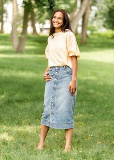 A straight button-front midi denim skirt is a classic staple for every woman’s wardrobe. The pewter buttons are functioning for the first 3 buttons and the rest are sewn in place - no need to worry about gaps between the buttons! Wear her with a classic button-up, a blouse or a tee - she will make anything look elevated! * Style | Midi * Color | Medium Wash SIZING TIPS * Fit| Semi-Fitted * Stretch | Mid-Stretch * Model | True to Size Modest Denim Skirts, Button Front Midi Skirt, Midi Denim Skirt, Denim Skirt Outfits, Midi Denim, Elevated Style, Professional Wardrobe, Church Dresses, School Dresses