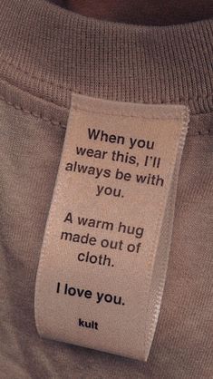 a person with a tag on their shirt that says, when you wear this i'll always be with you