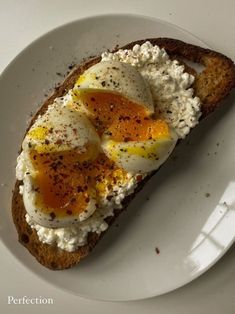 an egg on toast with cream cheese and seasoning