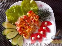 a white plate topped with cucumbers and other food