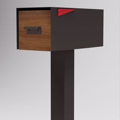 a wooden and metal mailbox with red paper sticking out of it's side