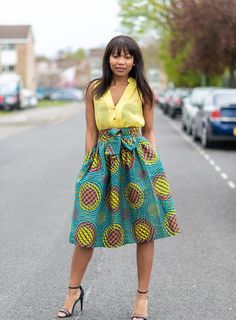 * A-Line midi skirt * Fully line * Belted to clinch in waist * Pockets * Zip at the back * 100% African Wax Print *  Made in s/files/1/0635/2158/7438/t/2/assets/] Care Instructions: Hand wash cold. Do not bleach. Hang dry. Press with cool iro... African Skirt Outfit High Waist, African Dress Patterns, Skirt African Print, African Wears, Belted Midi Skirt, Mid Length Skirt