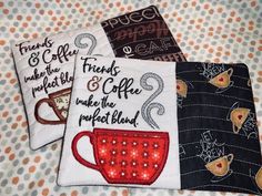 three coasters with coffee designs on them sitting on a table cloth covered surface,