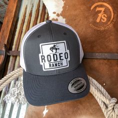 Dark grey Rodeo Ranch hat. Black and white Rodeo Ranch center patch. White mesh back. Adjustable snap back. Adjustable bill. Gray Trucker Hat With Logo Patch, Gray Trucker Hat With Logo Patch And Curved Bill, Ranch Hat, Cowgirl Accessories, Hit The Floor, Flat Bill Hats, Western Life, Ball Caps, Snap Back