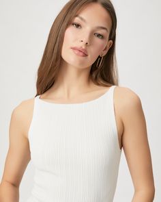 Crafted from a nylon blend with an elevated feel, this sophisticated white sleeveless sweater tank is designed with a pleated effect and a boat neckline. Yuelia is the perfect piece that adds a subtle statement to your summer wardrobe. | Yuelia Tank Top - White | Size XL Chic White Ribbed Tank Top, Elegant Fitted White Knit Top, Elegant White Scoop Neck Tank Top, Elegant Fitted White Tank Top, Elegant White Fitted Tank Top, White Ribbed Sleeveless Knit Top, White Sleeveless Fitted Knit Top, White Fitted Sleeveless Knit Top, Elegant Ribbed Tank Top For Summer