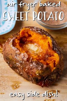 baked sweet potato sitting on top of a wooden cutting board with the words air fryer baked sweet potato easy side dish