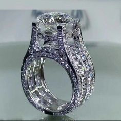 a close up view of a fancy ring with diamonds on it's shants