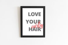 a framed poster with the words love your curly hair in red and grey on it