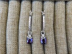 "Amethyst hoop earrings 1 1/8\" in diameter, cast and antiqued in sterling silver 925 with lever type ear wires, it has 8mm by 12mm amethyst briolettes, capped in sterling silver...from the ear wire to the end of the briolette it is 1 3/4\" total...well made earrings" Sterling Silver Jewelry With Purple Sterling Silver Clasp, Purple Sterling Silver Jewelry With Sterling Silver Clasp, Purple Sterling Silver Jewelry With Silver Clasp, Adjustable Purple Jewelry With Lever Back Ear Wires, Elegant Small Hoop Purple Earrings, Elegant Purple Small Hoop Earrings, Handmade Purple Dangle Hoop Earrings, Purple Dangle Hoop Earrings, Elegant Amethyst Dangle Hoop Earrings