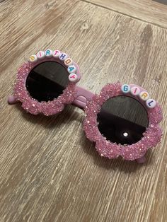 Personalized birthday girl sunglasses! Personalized sunglasses, made to order. Perfect for a birthday party to be used as favors or as a gift for a little girl! Fit best on children ages 2-12.  Each order comes with a sunglass sleeve. Each pair will include pink Sparkles. Please send a note if you would like personalization to be arranged a certain way, otherwise all glasses will vary slightly as glitter lays down.  You can choose from a variety of glasses colors with the pink glitter if you DM Cute Summer Birthday Party Supplies, Cute Birthday Party Supplies For Summer, Playful Personalized Pink Sunglasses, Cute Summer Sunglasses For Birthday, Cute Customizable Sunglasses For Gift, Fun Pink Summer Party Supplies, Summer Fun Pink Party Supplies, Personalized Pink Sunglasses For Beach, Fun Sunglasses With Uv Protection As Gift