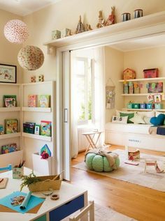 a child's room with bookshelves and toys on the shelves in it