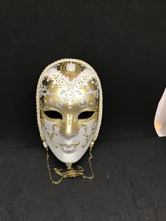 Venetian Mask for decoration - Traditional and original papier-mache Venetian mask, handmade and decorated with metal insert, gold-leaf and glitters,enriched with Swarovski crystals. Dimension: 31cmx22cm This is mask is not wearable cause the dimensions,it's very nice for the decorations All our masks are handmade papier-machè masks made in Venice. Our decorators use techniques typical of the Venetian tradition such as stucco, acrylics, gold and silver-leaf, macramè, passementerie, glitters and White Venetian Masks For Festivals, White Venetian Masks And Prosthetics For Festivals, White Venetian Mask For Costume, White Venetian Masquerade Mask As Gift, White Masquerade Mask For Carnival Festivals, White Venetian Masquerade Mask For Gift, White Mardi Gras Masks And Prosthetics, White Mardi Gras Masks And Prosthetics For Gift, White Masks And Prosthetics For Mardi Gras Gift