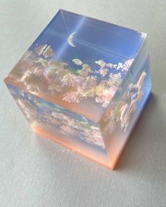 a glass block sitting on top of a table