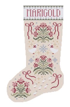 a cross stitch christmas stocking with the word margod on it's side