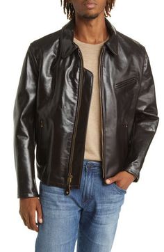 Thick and heavy cowhide leather means lasting style in this sleek racer jacket boasting a soft plaid lining and brassy goldtone hardware on the side buckles. 25 1/2" length Spread collar Zip cuffs Lined Leather Professional leather clean Made in the USA Classic Fall Biker Jacket With Leather Lining, Classic Leather-lined Biker Jacket For Fall, Classic Biker Jacket With Padded Collar For Work, Classic Leather Jacket With Zipper For Work, Classic Biker Jacket For Fall With Zip Fly, Classic Leather-lined Biker Jacket For Business, Classic Outerwear With Zipper Closure, Classic Leather Jacket With Padded Collar For Fall, Classic Leather Jacket For Fall