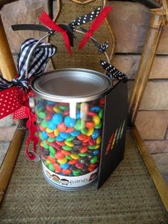 a bucket filled with candy sitting on top of a chair