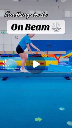 a woman standing on top of a blue trampoline in a gym with the words, fun things to do on beam