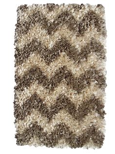 a brown and white area rug on a white background