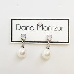 "Minimalist pearl earrings, Refined dainty bridal earrings, Cubic zirconia and round pearl wedding earrings Small and delicate bride earrings that you'll feel comfortable with as their tenderness will comply with any headpiece. Length: 0.75\" inch (1.8 cm) Item will arrive in a beautiful gift box with my brand logo, ready for gift giving, even to yourself :) Materials: * high quality of coating, Nickel free coating and white round pearl. * Care instructions: My jewelry is made by me with great c Silver Dainty Pearl Earrings With Cubic Zirconia, Pearl White Cubic Zirconia Bridal Earrings For Gift, Silver Cubic Zirconia Dainty Pearl Earrings, Dainty Silver Pearl Earrings With Cubic Zirconia, Dainty Diamond White Diamond Earrings For Wedding, Bridal Pearl Drop Earrings With Cubic Zirconia As Gift, Dainty Pearl Earrings With Cubic Zirconia For Formal Occasions, Pearl Drop Earrings Gift Round Cut, Round Cut Pearl Drop Earrings For Gift