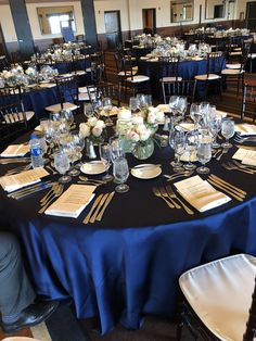 the tables are set up with place settings for formal dinner guests to sit down and eat