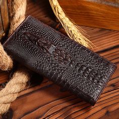 Elevate your style with our Chic CrocGloss Crocodile Pattern Standard Wallet, crafted with genuine cow leather for a touch of luxury and sophistication. Measuring at a height of 2cm, width of 9.5cm, and length of 18.5cm, this wallet offers ample space for your essentials while the solid pattern ensures timeless appeal. Upgrade your accessory game and make a statement wherever you go with our durable and stylish wallet. Zippered Clutch, Crocodile Pattern, Card Patterns, Genuine Leather Belt, Leather Belts, Casual Everyday, Clutch Wallet, Solid Pattern, Compact Design