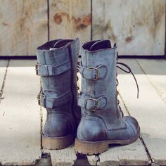 A mix of rugged & sweet pair on these combat boots. Designed with a lace up front, these boots feature darling military buckle and zipper details, a rugged sole, distressed styling, and sweet stitch detailing. Perfect paired with a bohemian dress or skinnies for the season. Color: Distressed dark brown Heel Height: 1"