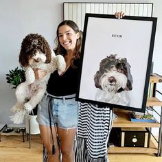 a woman holding two dogs in front of her and posing for the camera with them