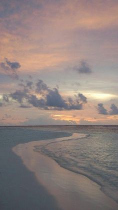 the beach is clean and empty at sunset