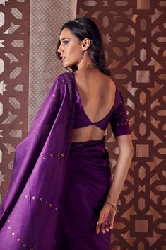 Editor's Note This Resplendent Purple Saree Embellished With Delicate Brass Rings All Over Portrays Richness While The Crochet Lace Border All Around Adds To The Pretty Charm. The Sleeves Of The Perfectly Cut Blouse Are Intricately Designed And The Deep V-neck At The Back With Hook Closure Adds To The Glam Quotient. Fabric: Blouse: Chanderi Lining: Cotton Saree: Chanderi Color: Purple Care: Dry Clean Only About the Designer A brand that seeks inspiration in the classics while honouring minimalis Deep V Back Blouse, V Back Blouse Design, V Neck Back Blouse Design, Deep Round Neck Blouse Design, Blouse Designs Deep Neck, Back V Neck Blouse Design, Deep Blouse Back Design, Deep Back Blouse Design, Deep V Neck Blouse Indian