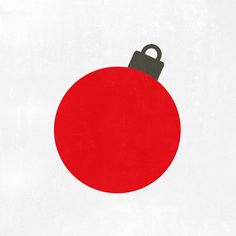 a red christmas ornament with a black handle on it's side, against a white background