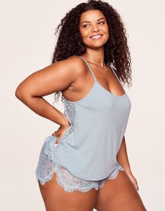 A sweet and sultry set that's great for lazy mornings or date nights in, Reign comes with a blue lace-trimmed camisole top and matching shorts. The short set features an allover lace tap short with an elastic waistband for a comfy and flattering fit. (Available in plus-sizes 0X-4X.) Lace Pajama Set, Leslie Sidora, Chic Bra, Adore Me, Loungewear Set, Pajamas Set, Bra And Panty Sets, Short Set, Plus Size Lingerie