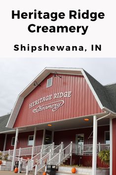 the heritage ridge creamery is located in this red building with white railings and steps leading up to it