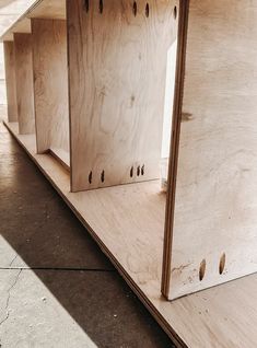 the shelves are made out of plywood and have holes in them for extra storage