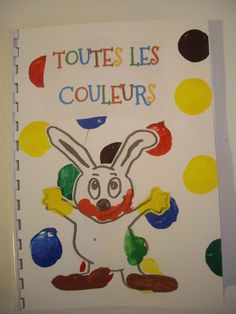 a child's book with an image of a bunny holding a ball and the words, toutes les couleurs