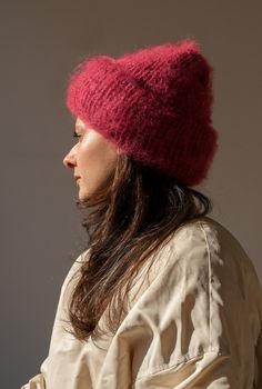 a woman wearing a red knitted hat