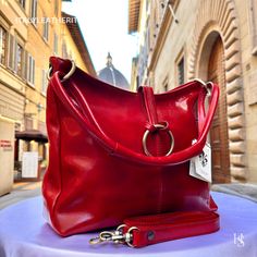 This bag has been made of the best genuine leather by local master crafters of Florence in Italy, designed for women who only accept premium Italian quality and luxury leather bags and modern Italian fashion. . Sizes: Width: 33cm / 13inches Height: 26cm/ 10.3 inches Depth: 12cm/ 4.8 inches . The story of this bag: Once upon a time, in the heart of Florence, Italy, a skilled artisan embarked on a journey to create the epitome of elegance and sophistication: the Florence Leather Bag. Meticulously crafted with the finest materials and an unwavering passion for craftsmanship, this custom leather bag quickly became a symbol of timeless style. Each Florence Leather Bag is a true work of art, designed to capture the essence of individuality and grace. The artisans pour their hearts into handcraft Modern Red Shoulder Bag With Leather Lining, Chic Red Shoulder Bag With Smooth Grain, Elegant Red Satchel With Leather Handles, Chic Red Bag With Smooth Grain, Luxury Smooth Grain Shoulder Bag As Gift, Red Smooth Grain Top Handle Shoulder Bag, Red Top Handle Shoulder Bag With Smooth Grain, Elegant Red Bag With Smooth Grain, Red Top Handle Bag With Smooth Grain