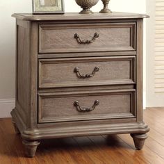 a wooden dresser sitting on top of a hard wood floor