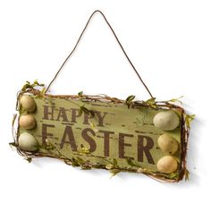 a sign that says happy easter with eggs hanging from it's sides and vines