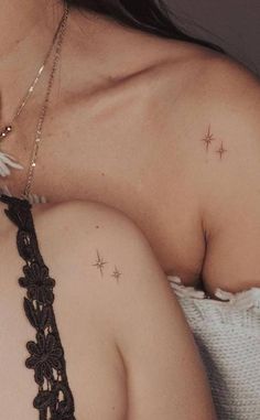 a woman's shoulder with stars on it