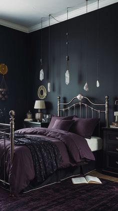 a bedroom with black walls and purple bedding