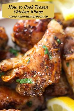 how to cook frozen chicken wings with lemons and parsley on the side in a white bowl