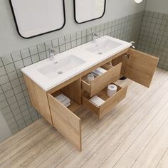 a bathroom with two sinks and mirrors on the wall