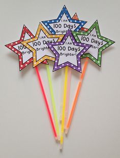 five star shaped pencils with the words 100 days written on them in bright colors