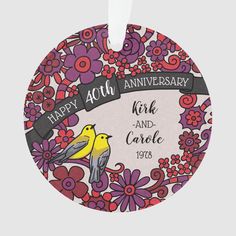 an anniversary plate with two birds on it