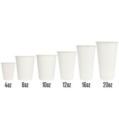 a row of white cups sitting next to each other