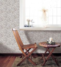 two wooden chairs sitting next to each other in front of a window