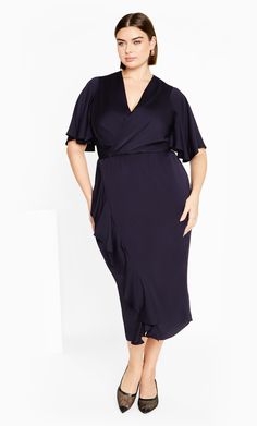 The Soft Ruffle Dress brings a refreshing style with a charmingly chic style. Designed with feature ruffle detail, a deep faux wrap pleat V neckline and textured sateen feel stretch, this dress is destined to turn heads. Key Features Include: - Deep faux wrap pleat V-neckline - Short flutter sleeves - Elasticated back waistband - Faux wrap drape skirt - Feature ruffle detail - Pull over style - Textured sateen feel stretch fabrication - Satin lined Love this piece with a pair of emerald-hued hee Chic Ruched V-neck Ruffle Dress, V-neck Midi Dress With Ruffles For Formal Occasions, Chic V-neck Midi Dress With Folds, Elegant V-neck Ruffle Dress For Evening, Elegant Evening Midi Dress With Faux Wrap, Elegant Midi Dress With Flutter Sleeves And Ruffle Hem, Elegant Wrap Dress With Ruffle Hem For Brunch, V-neck Satin Dress With Ruffles, Elegant Midi Length Faux Wrap Dress