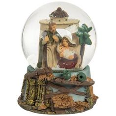 a snow globe with a nativity scene in it